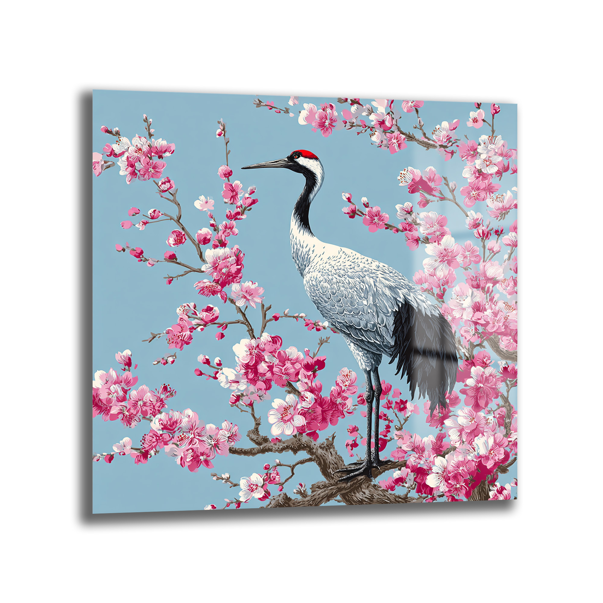 Zen Bahçesi: Sakura ve Turna Kuşu Cam Tablo Duvar Dekoru Açık mavi zeminde pembe sakura çiçekleriyle dolu bir dalda duran, kırmızı tepeli Japon turna kuşu figürlü cam tablo.