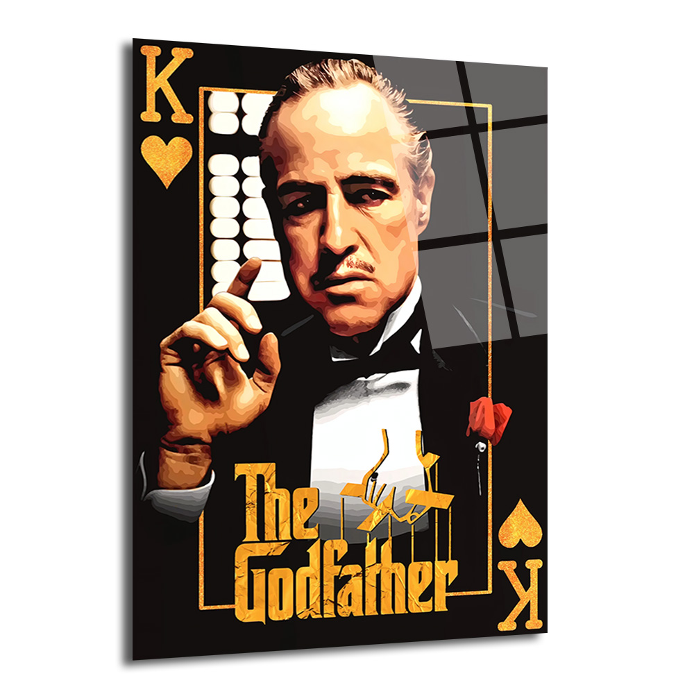 The Godfather Vito Corleone Temalı Cam Tablo - Efsanevi Portre Duvar Dekoru Siyah arka plan üzerinde, The Godfather filminden Vito Corleone'nin karizmatik portresi bulunan, sağ üst ve sol alt köşelerde altın kalp sembollü 'K' harfi ile iskambil kartı motifinde tasarlanmış cam tablo.